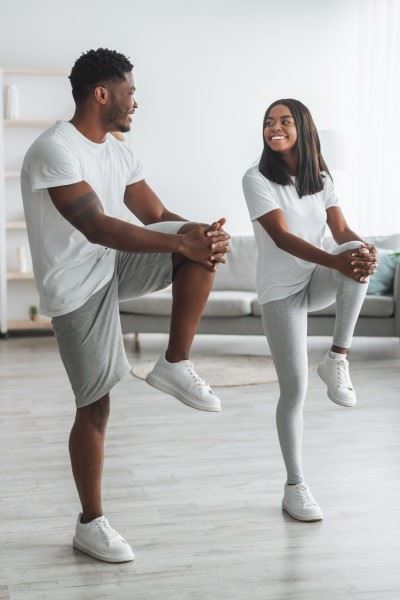 woman and man doing exercises for knee