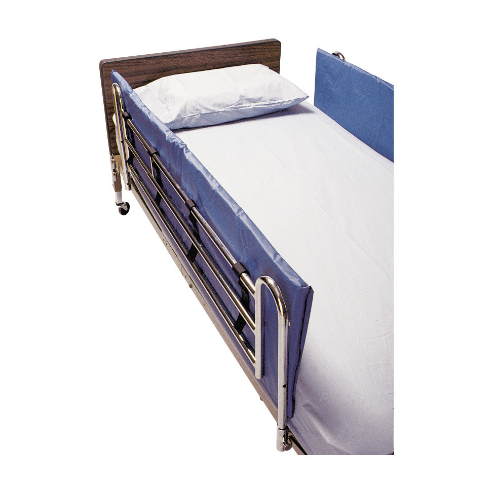 A SkiL-Care Vinyl Bed Rail Pad on a hospital bed provides cushioning along the metal bed rails with a blue vinyl cover.