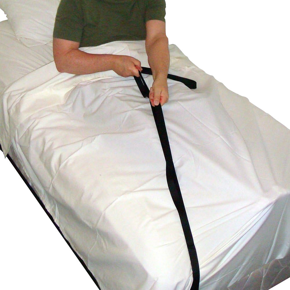 A person lying on a bed is using a SafetySure Economy Bed Pull-Up, a black strap aid, to sit up on white sheets.