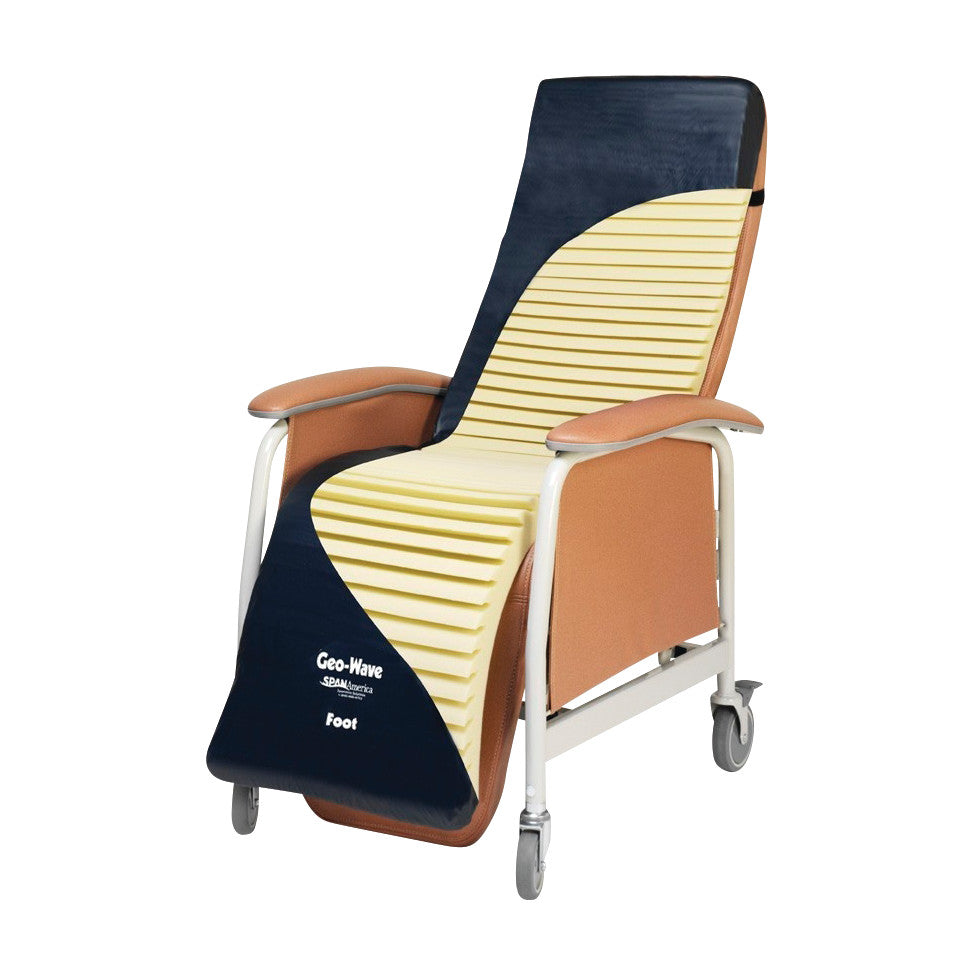Geo-Wave Specialty Recliner Cushion on a medical chair with armrests and wheels, featuring a beige and dark blue striped design.