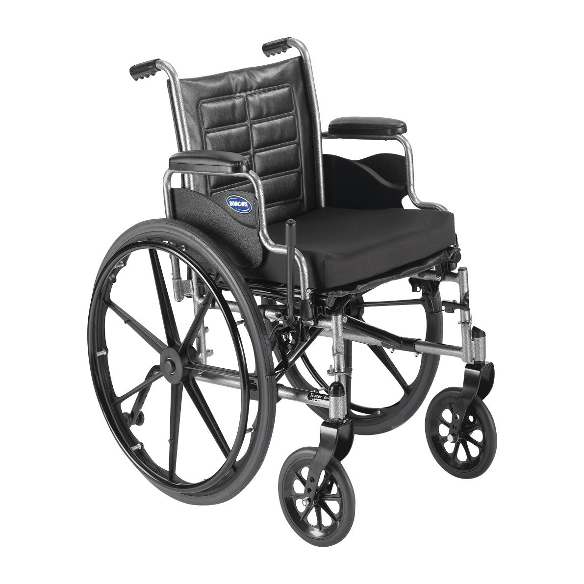 The Invacare Tracer IV Wheelchair with Desk Arms and Urethane Tires features a black cushioned seat and large rear wheels.