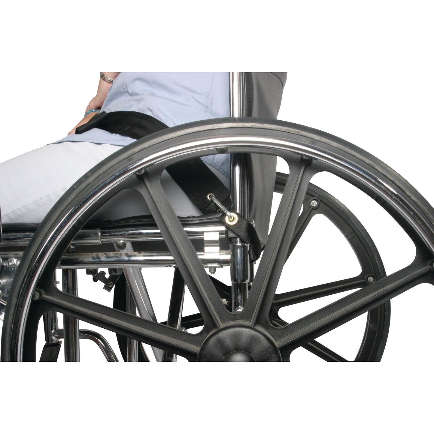 A person sits in a wheelchair with the AliMed UniLoop Seatbelt Attachment securing them. The seatbelt is connected to the frame.