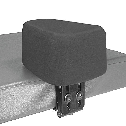 Therafin Flip-Down Abductor attached to a padded bench, shown in a folded position with visible mounting hardware.