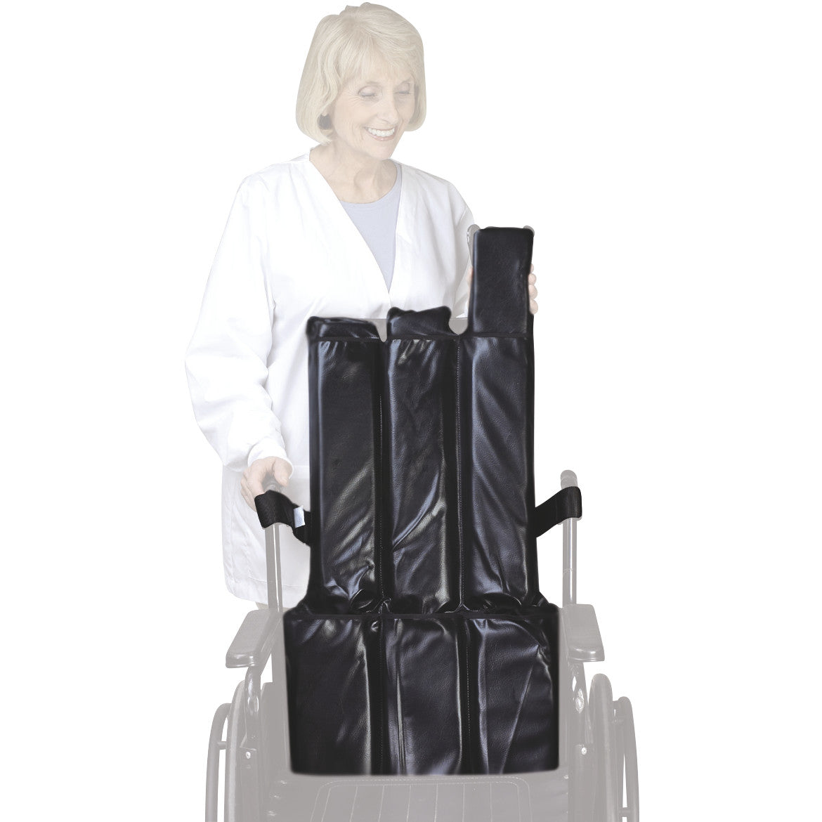 A woman holds a SkiL-Care Reclining Wheelchair Backrest, showing its black padded sections designed for comfort and support.