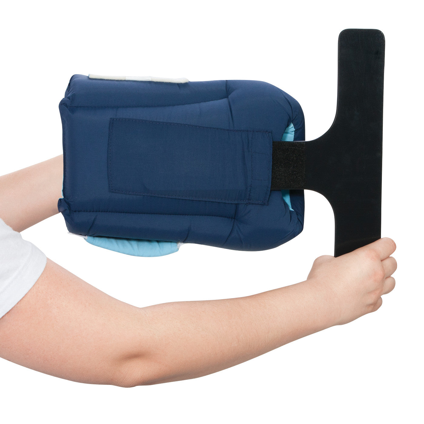 A person's hands hold the AliMed Heel-Up Foot Positioner, designed in blue with a black "T" handle for adjusting foot elevation.