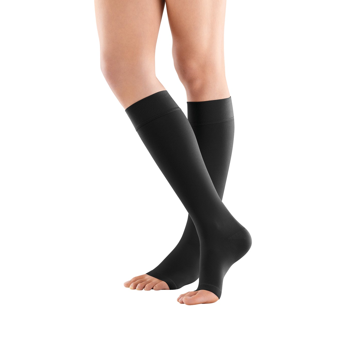 Person wearing Bauerfeind VenoTrain micro AD Open Toe Compression Stockings, black, knee-high, with open toes on bare legs.