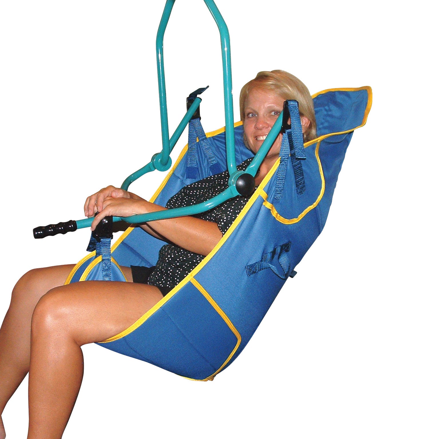 A person is seated in a blue Replacement Patient Lift Sling with yellow trim, supported by metal bars, smiling at the camera.