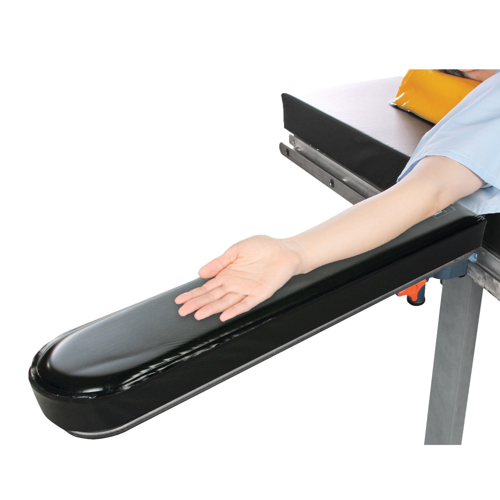 A person's arm rests on the AliMed Gel Composite Armboard Pad, a black cushioned support attached to a table.