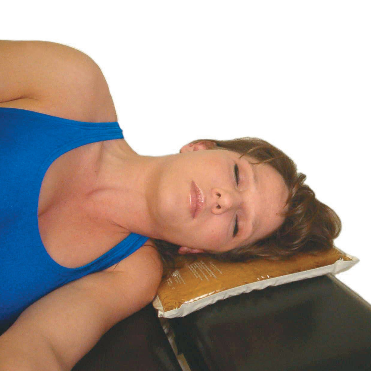 A person rests their head on the AliMed AliGel Lateral Head Pad, providing support and comfort while lying on their side.