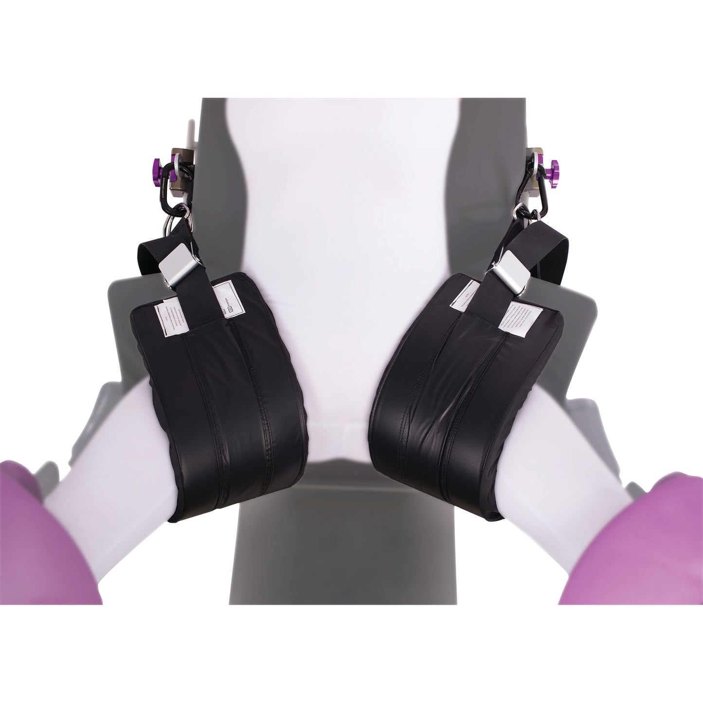 The KYRA Nissen Strap supports a patient's legs, secured with black padded straps on a medical chair or examination table.