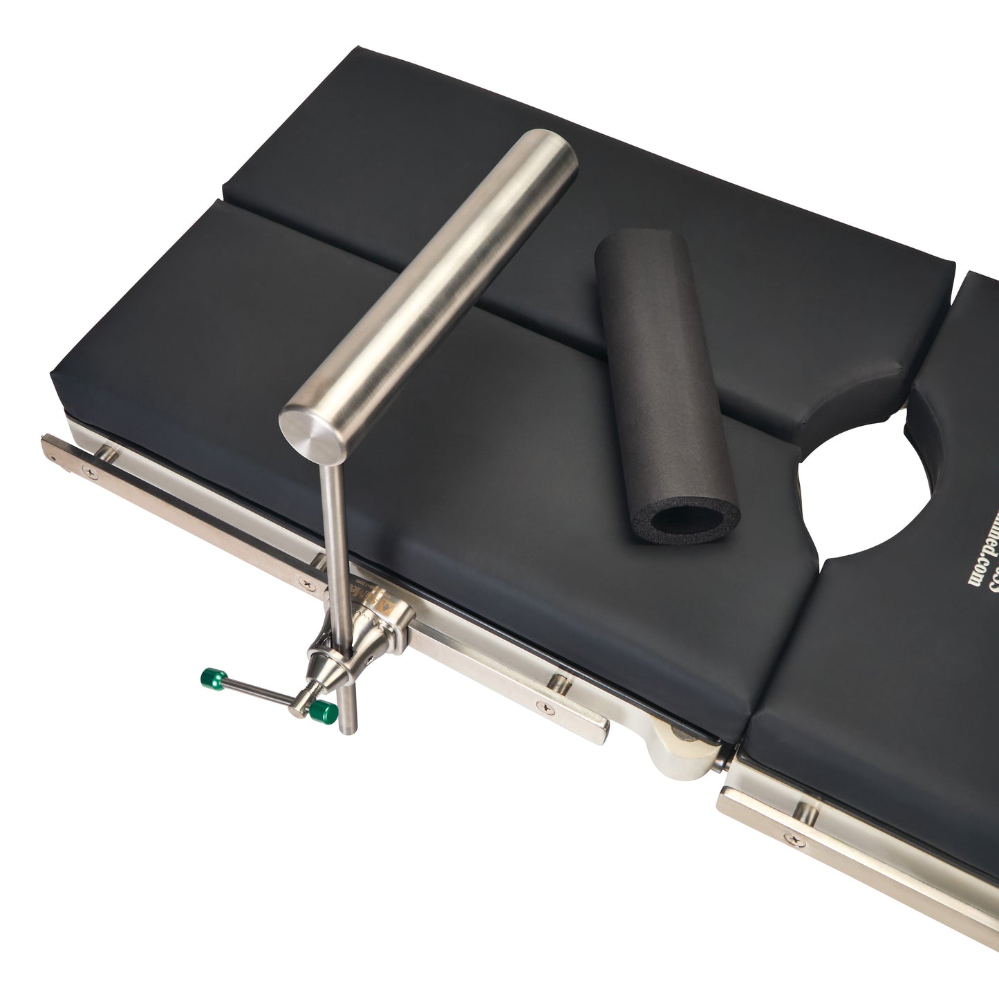 AliMed Stainless Steel Total Knee Replacement (TKR) Support with black padding and a removable foam roller on a surgical table.