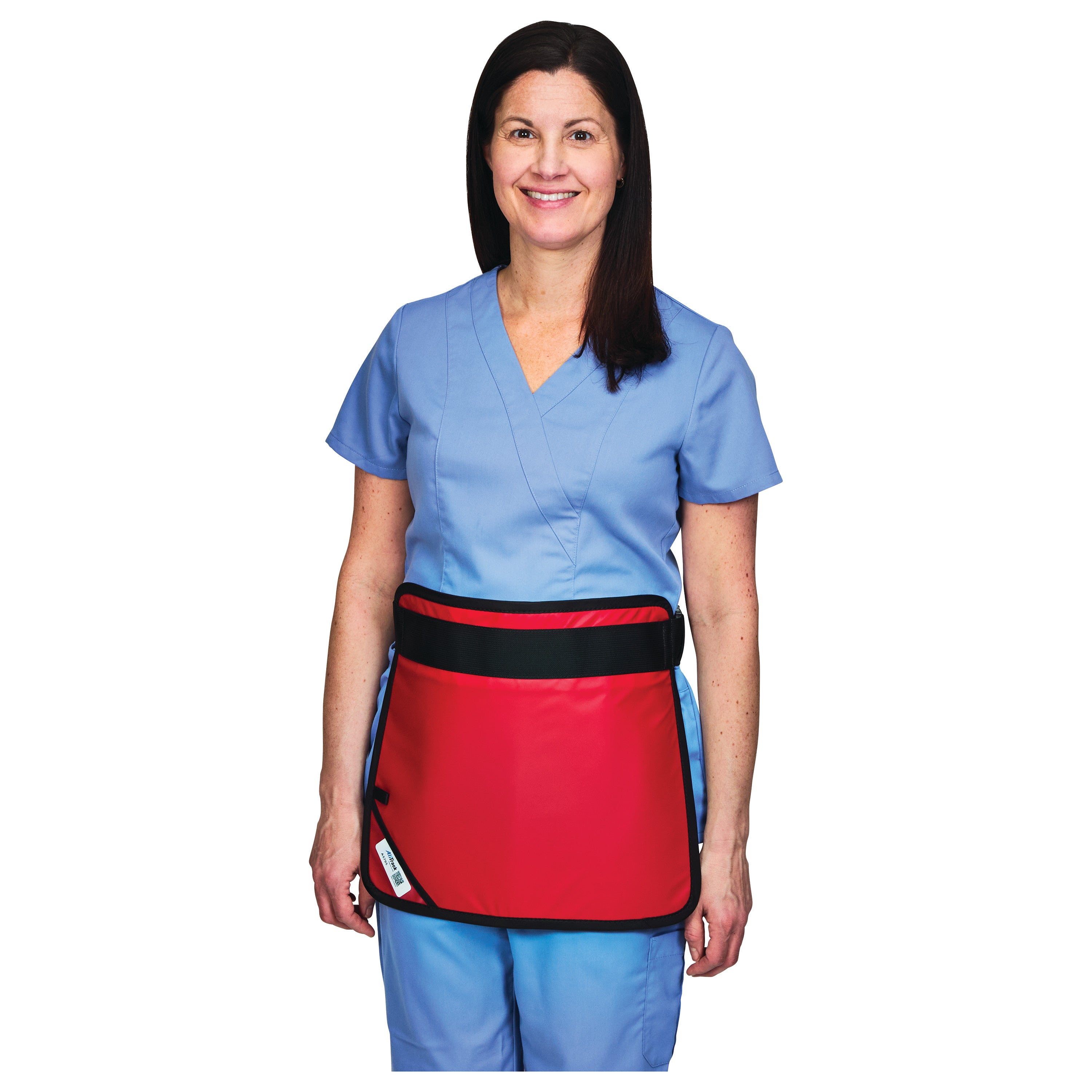 A person in scrubs wears a blue outfit with a red AliMed Mini Apron secured by a black strap around the waist.