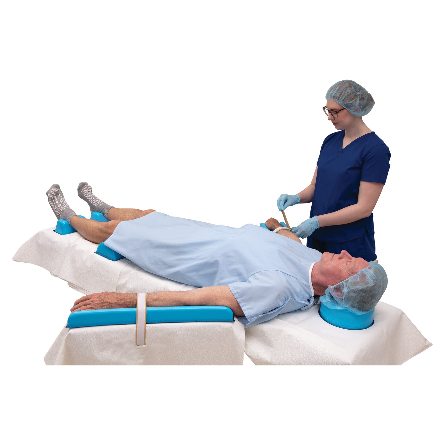 A healthcare worker adjusts a patient's arm on an AliMed AliBlue Lite Hybrid Gel Contoured Armboard Pad in a medical setting.