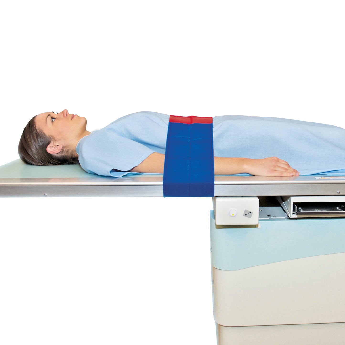 A person lies on a medical table secured by the AliMed Universal Strap, One-Piece, One Closure, No Side Rail, in blue and red.