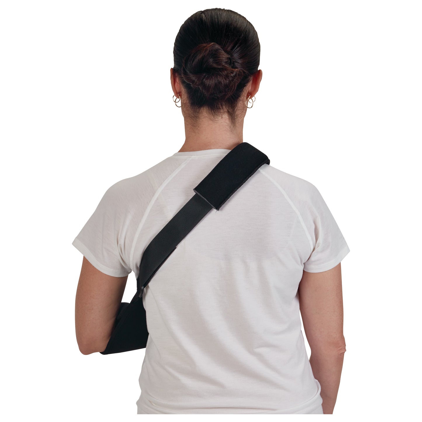A person from behind wearing a CVA Sling in black, supporting their left arm over a white shirt.