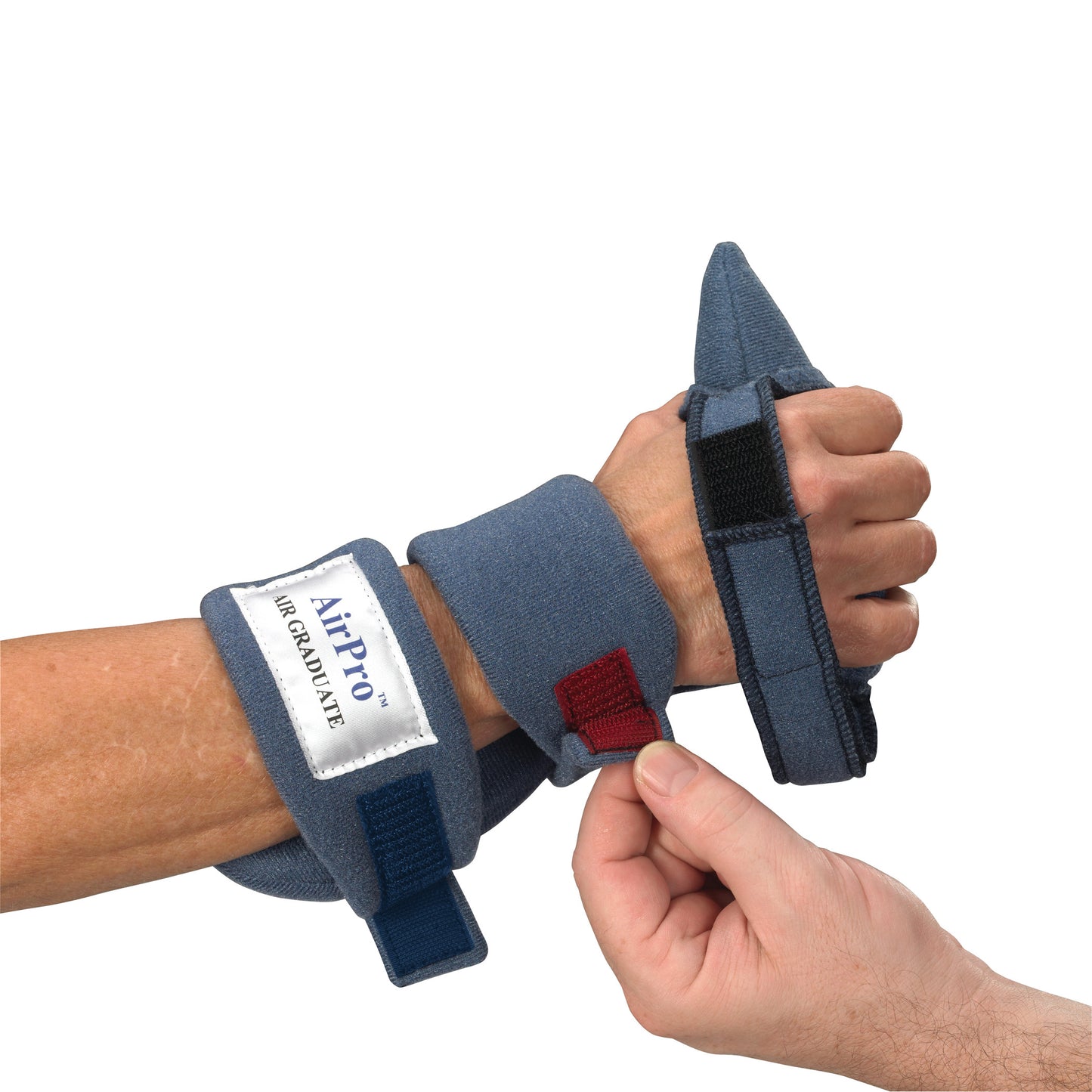 A hand is wearing an OCSI AirPro Air Graduate WHFO orthotic device with adjustable straps, providing wrist and finger support.