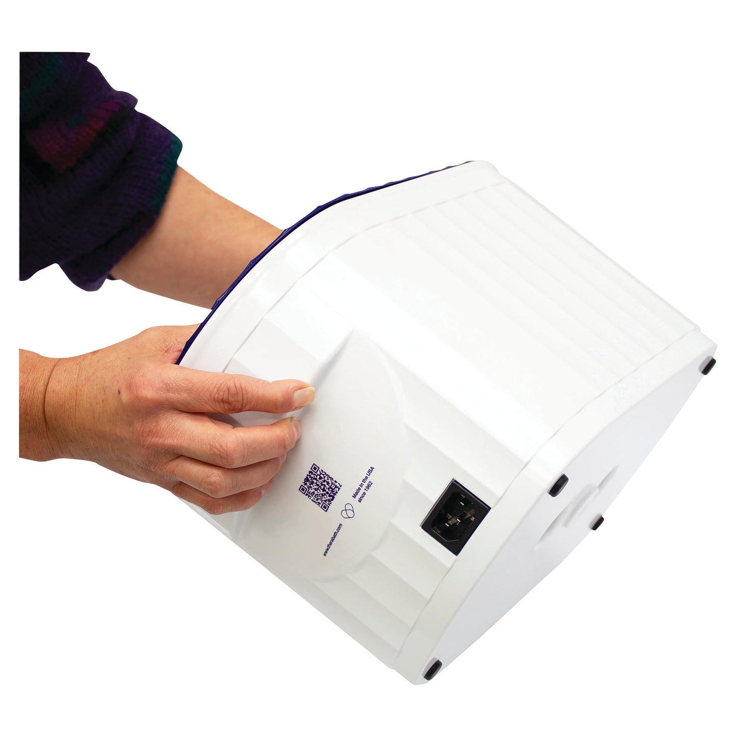 A hand holds the Therabath Professional Thermotherapy Paraffin Bath, showing its white, rectangular design with a power socket.
