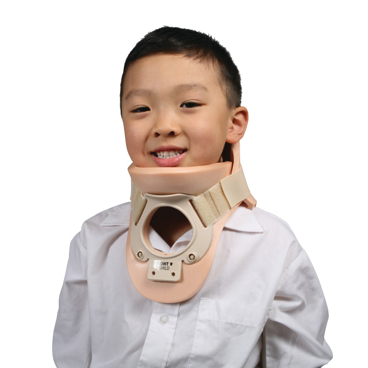 A child wearing an ssur Philadelphia Pediatric Tracheotomy Collar, smiling while dressed in a white shirt against a plain background.
