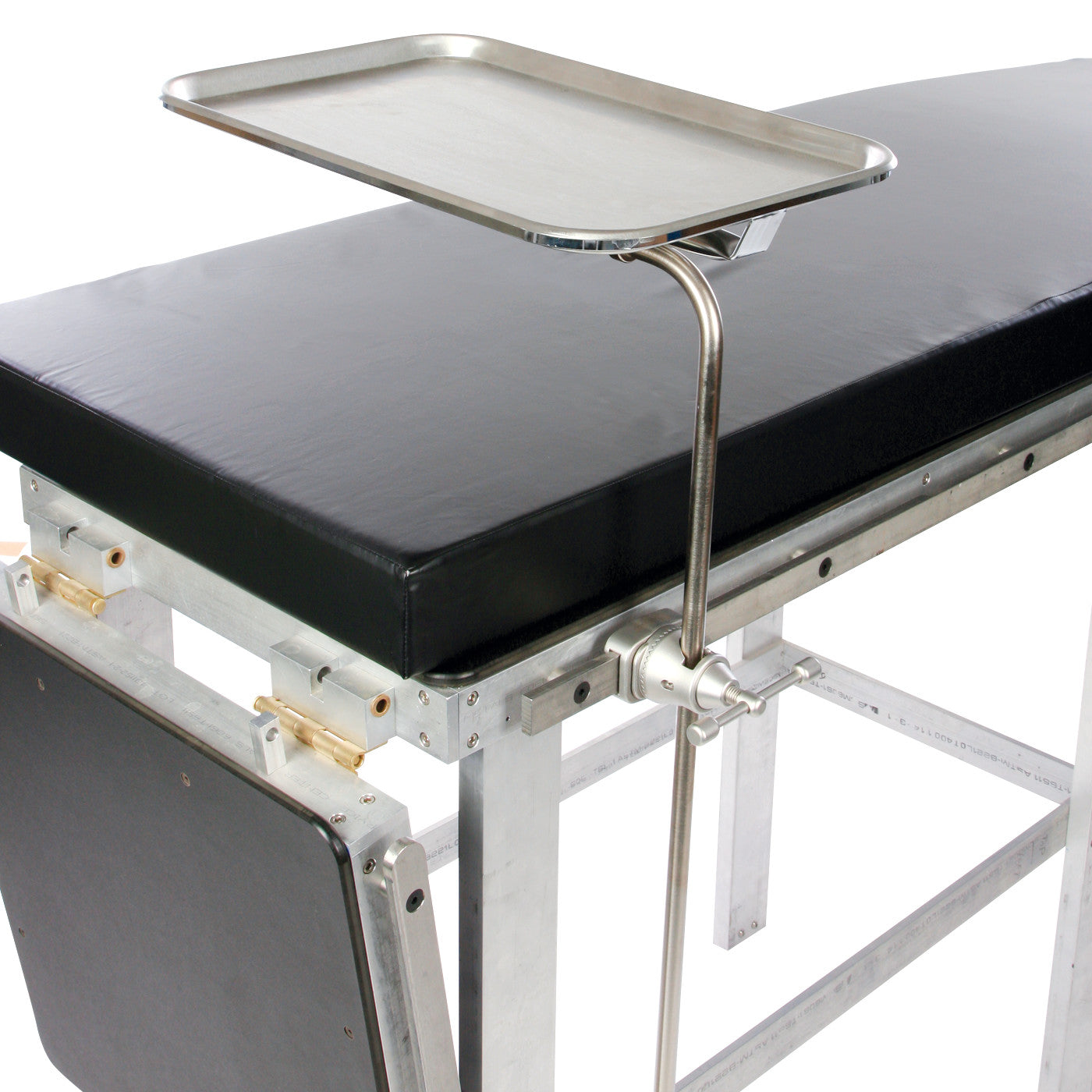 AliMed Side Rail Mounted Mayo Stand attached to a medical table with a black cushion, showcasing an elevated stainless steel tray.