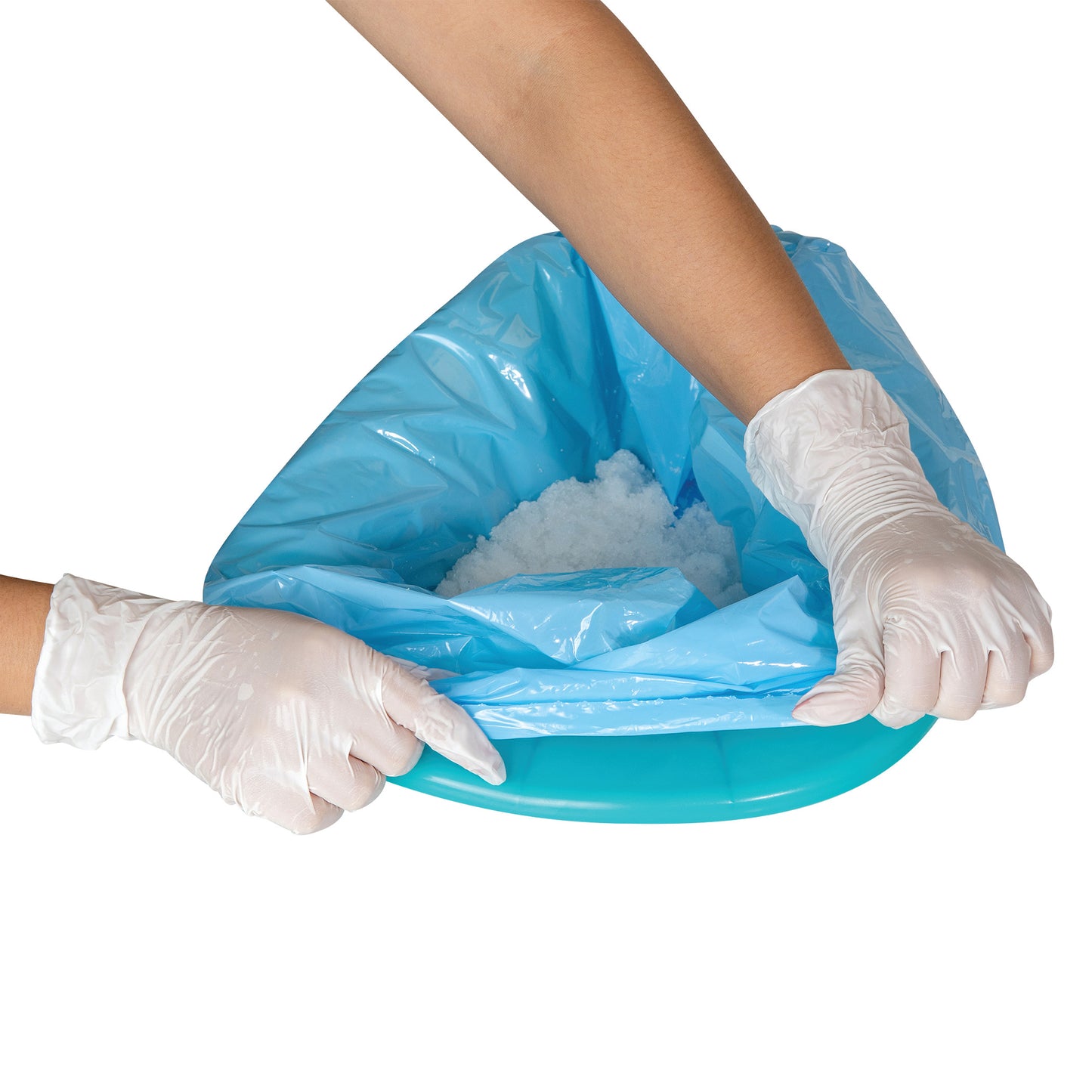 Hands in gloves hold a blue SANI-BAG+ Commode Liner filled with absorbent material.