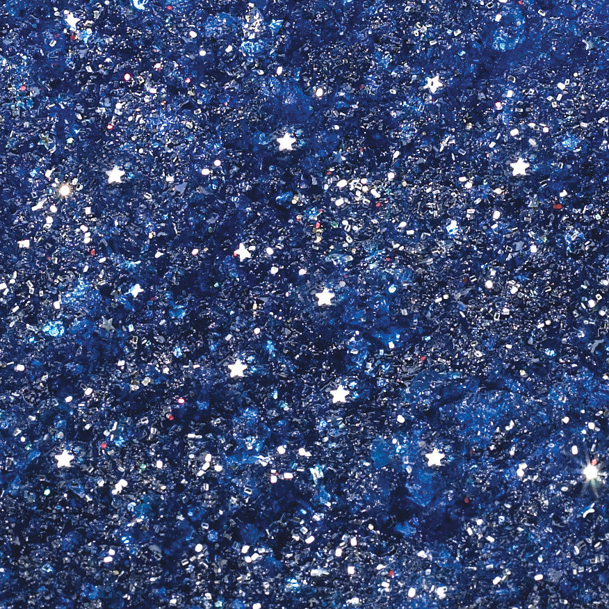 Close-up of SkiL-Care Starry Night Wheelchair Cushion, featuring a glittery blue surface with star-shaped accents.