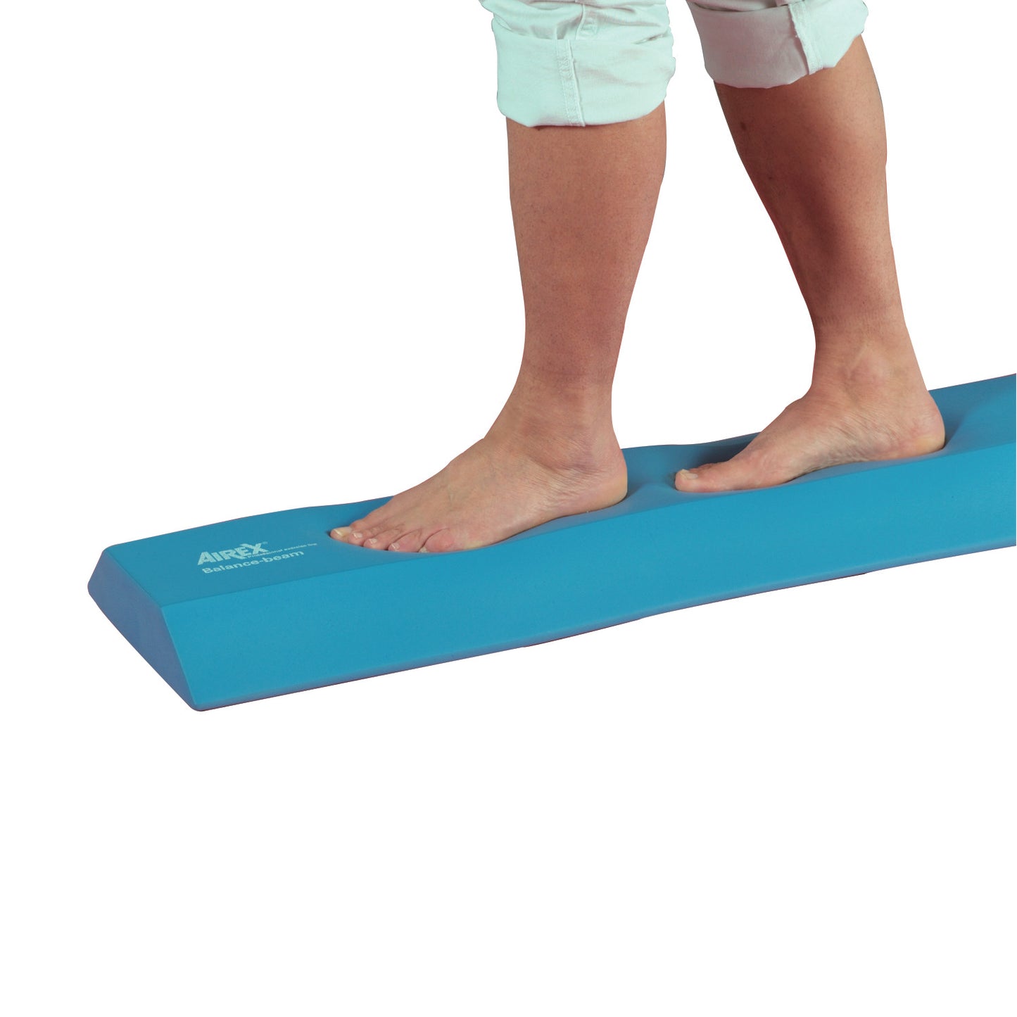 Bare feet balancing on a blue AIREX Balance Beam, with the person's legs partially visible.