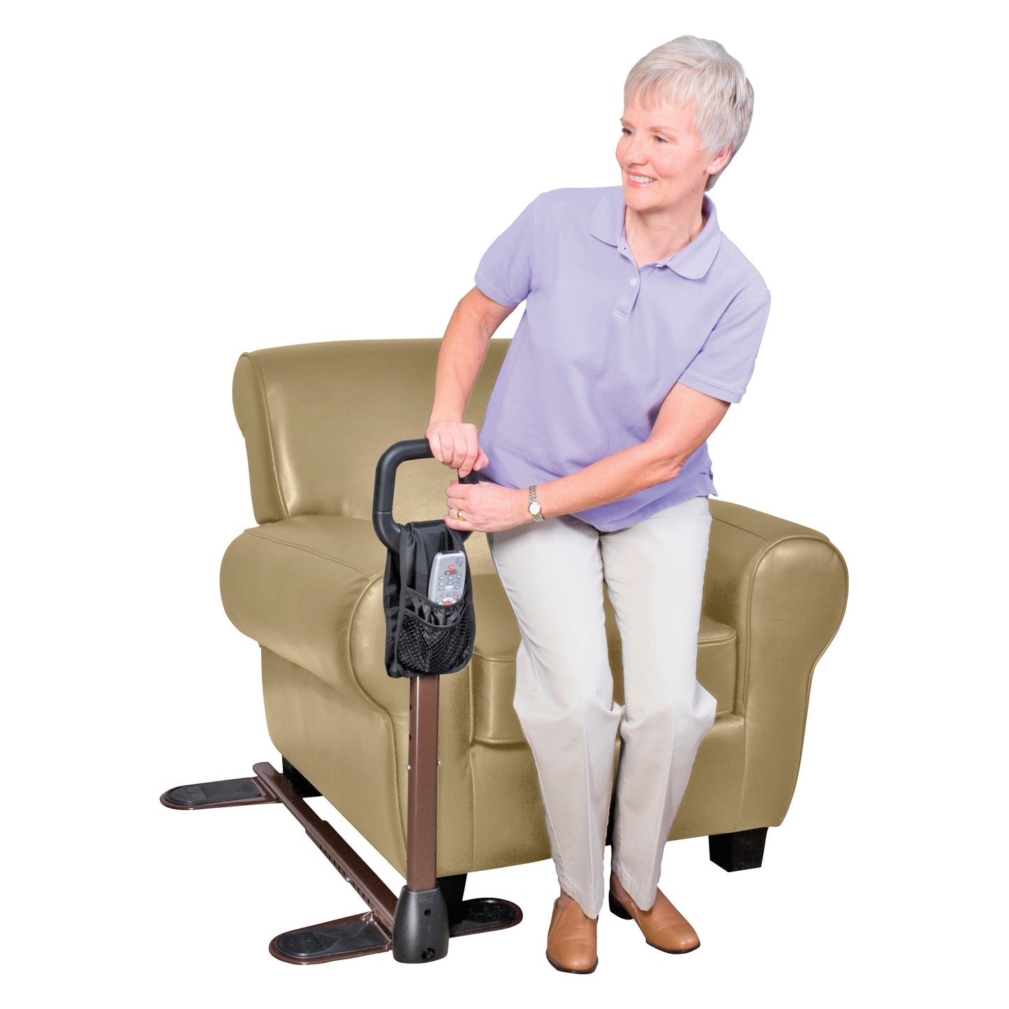 An elderly woman uses the Stander CouchCane for support while rising from a beige armchair.
