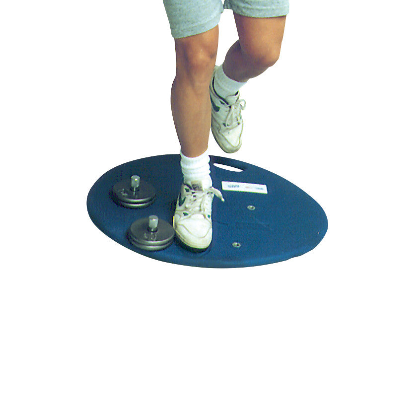 Person using the BAPS (Biomechanical Ankle Platform System) balancing board, demonstrating ankle rehabilitation exercise.