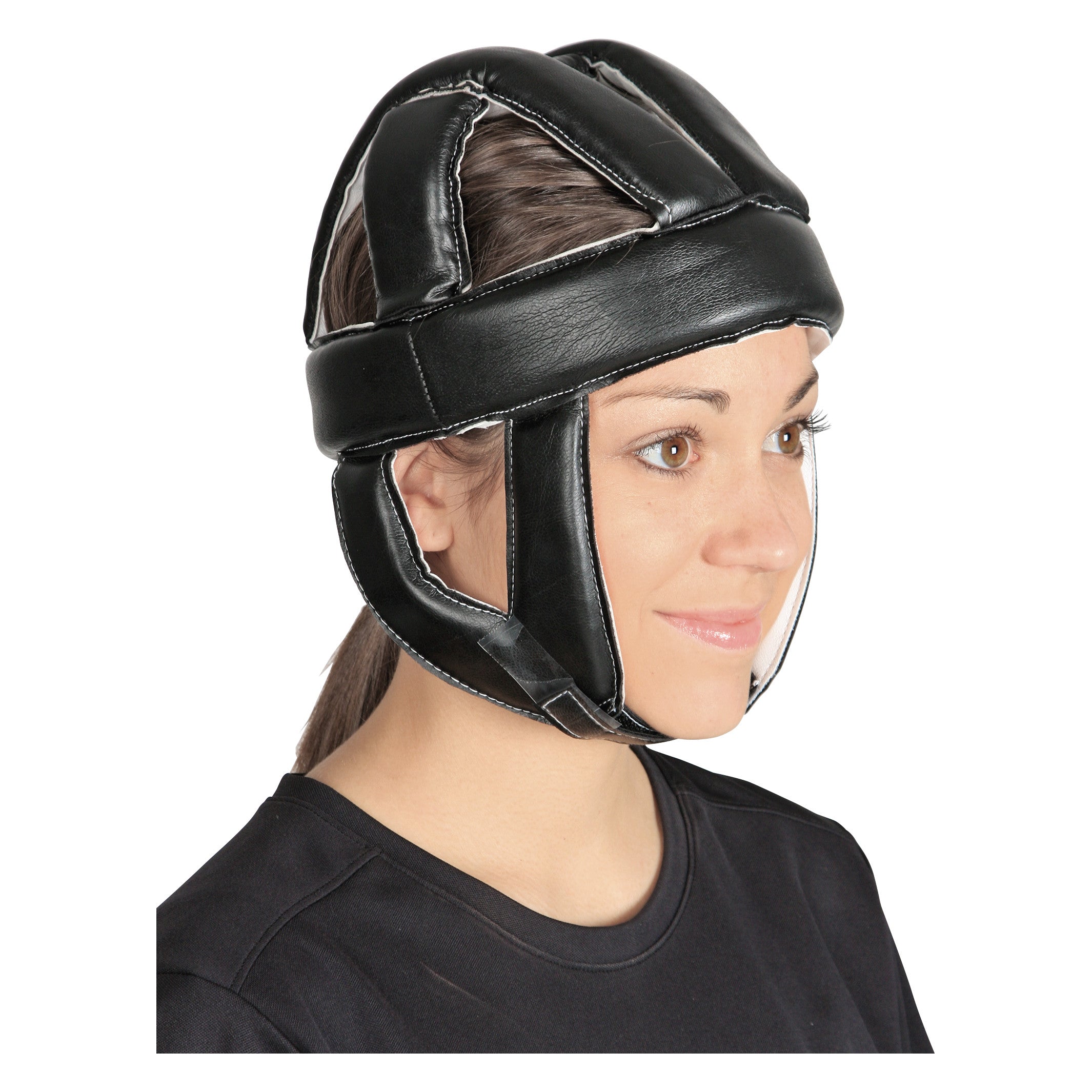 A person wearing a black Skillbuilders Protective Helmet. The helmet covers the head and chin, secured with a strap.