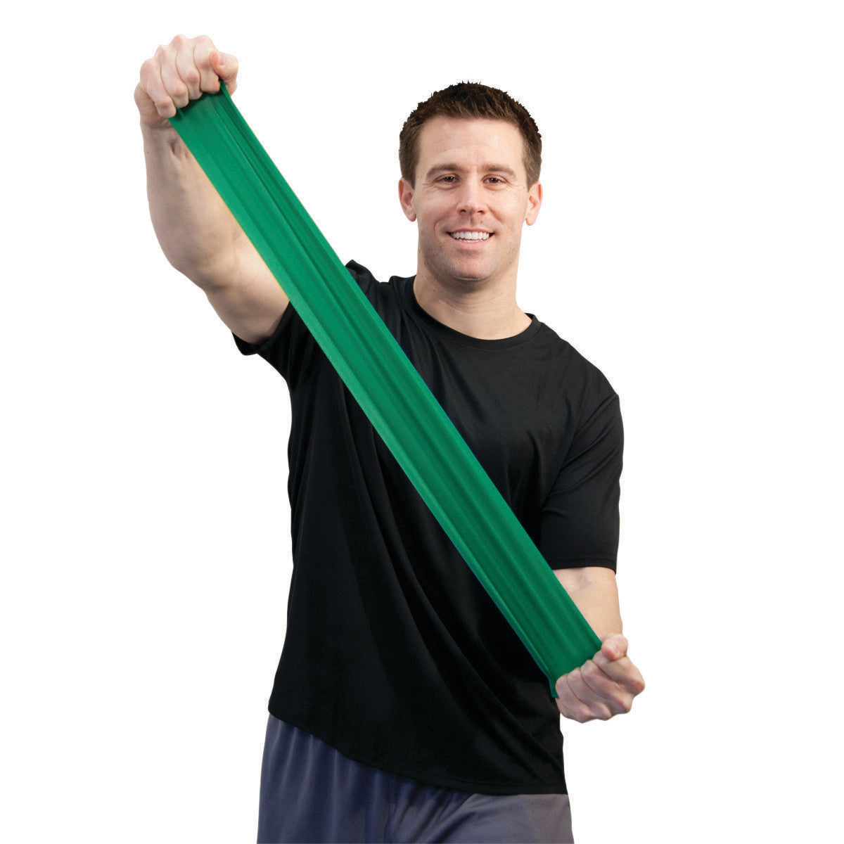 A person stretches the green CanDo Sup-R Band Non-Latex Exercise Band, wearing a black shirt, against a white background.