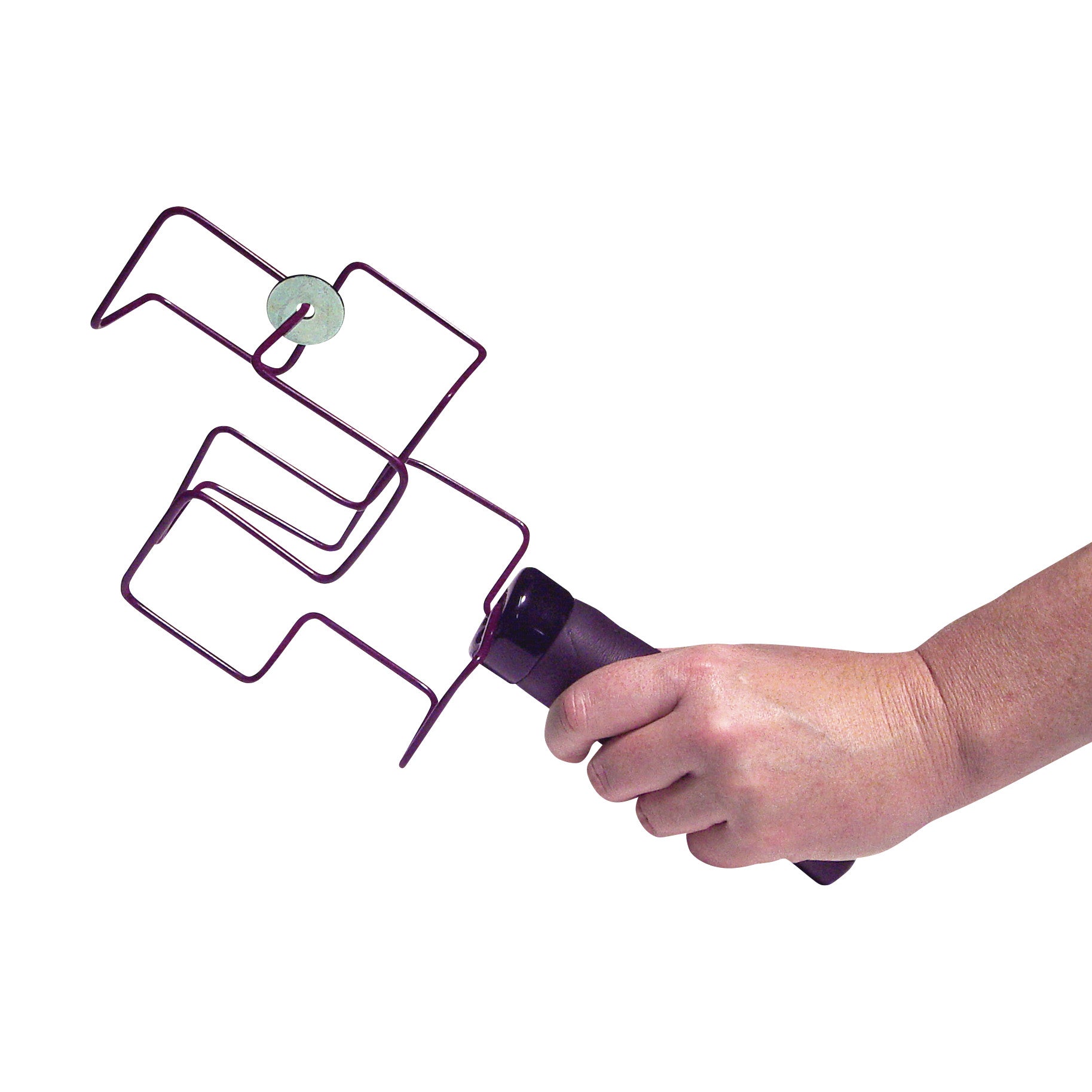 A hand holding a Jux-a-Cisor ROM Exerciser, featuring a metal wire design with a circular attachment, used for physical therapy.