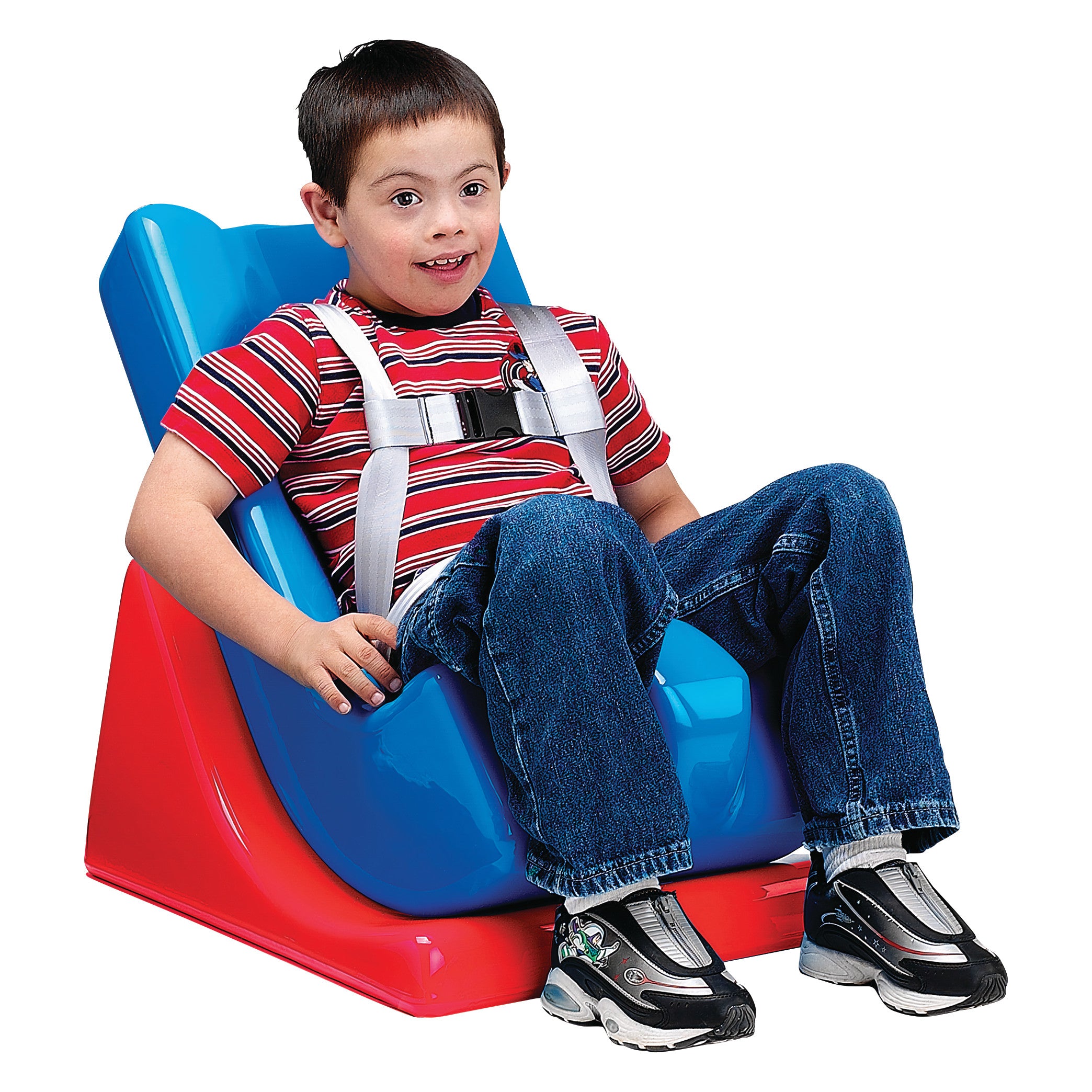A child sits in a blue Tumble Forms2 Feeder Seat on a red Wedge Base. The seat features a harness for support.