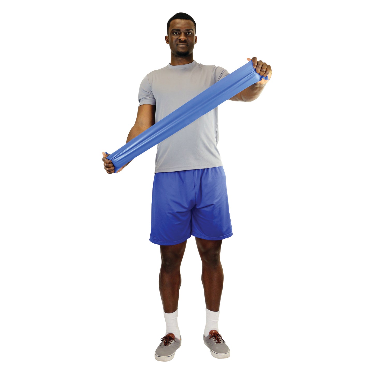 A person uses a CanDo Non-Latex Exercise Band, wearing a gray shirt and blue shorts, performing a stretching exercise.