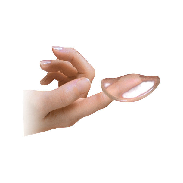 A hand holds a Silipos Body Disc on its fingertip. The disc is transparent and crescent-shaped against a white background.