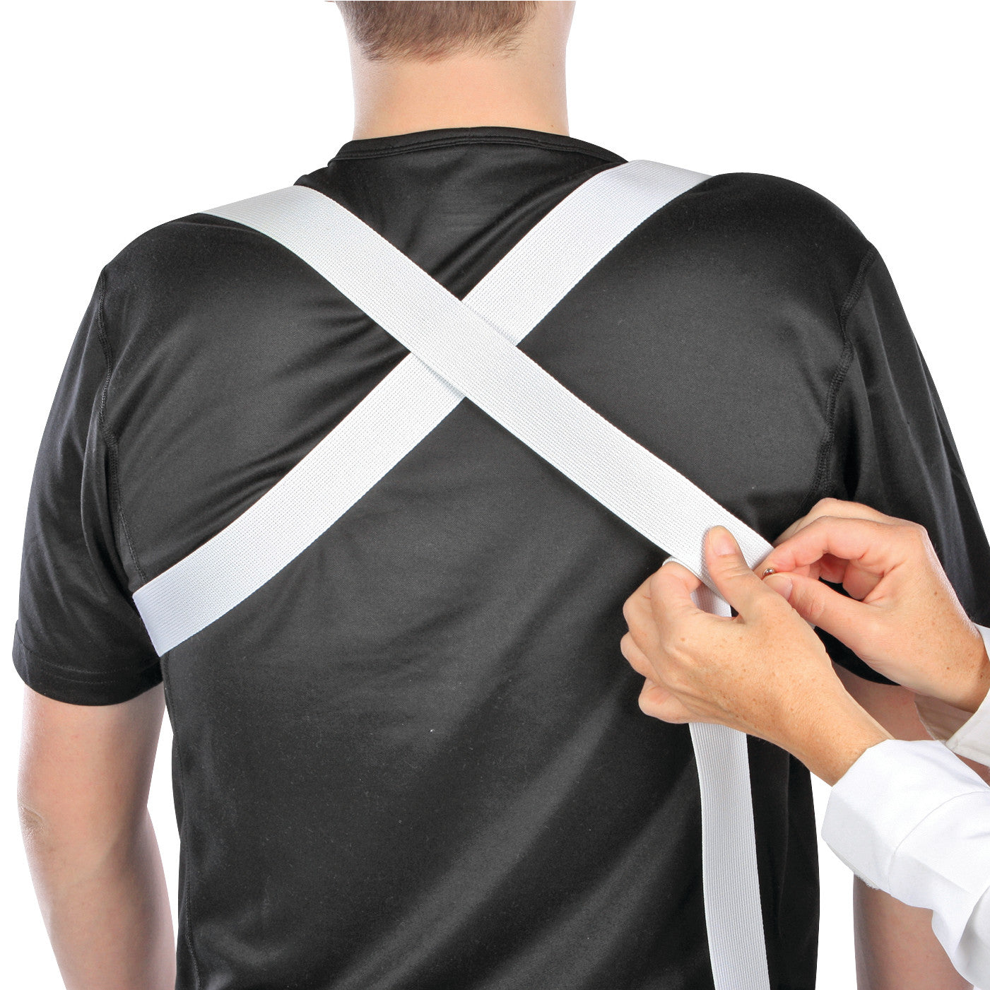 A person is adjusting white Webbing straps on a back brace, crossing over a black shirt.