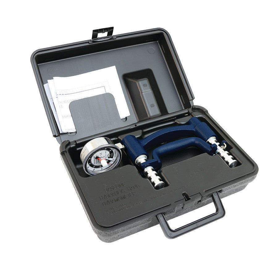 Baseline Analog Dynamometer in an open black plastic case with instructional papers and measurement dial visible.