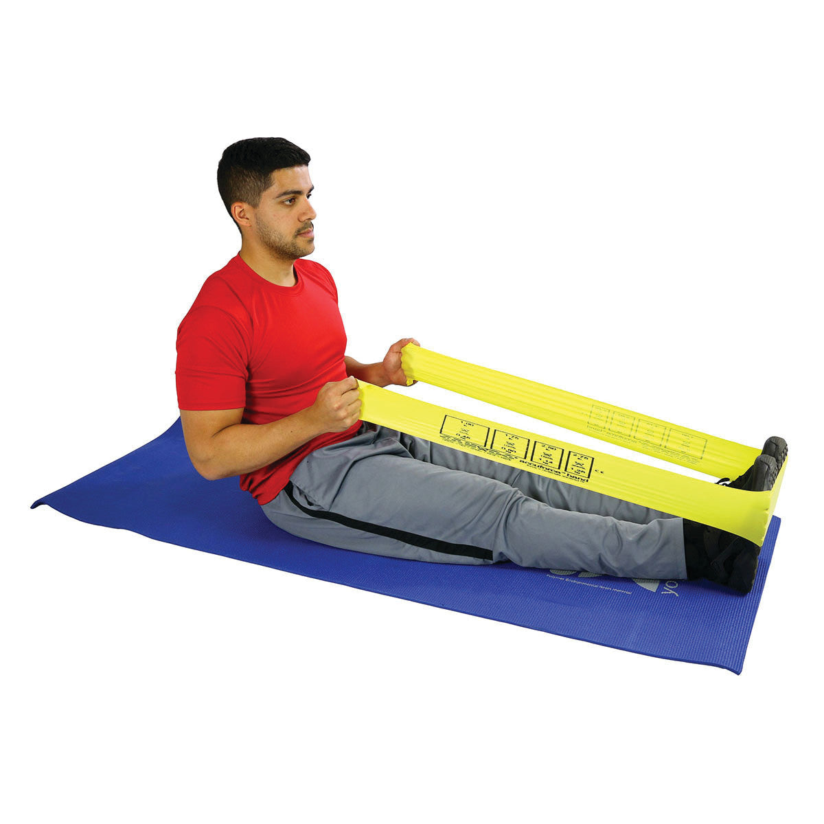 A person exercises with a yellow CanDo AccuForce Latex Exercise Band, sitting on a blue mat with legs extended and band around their feet.