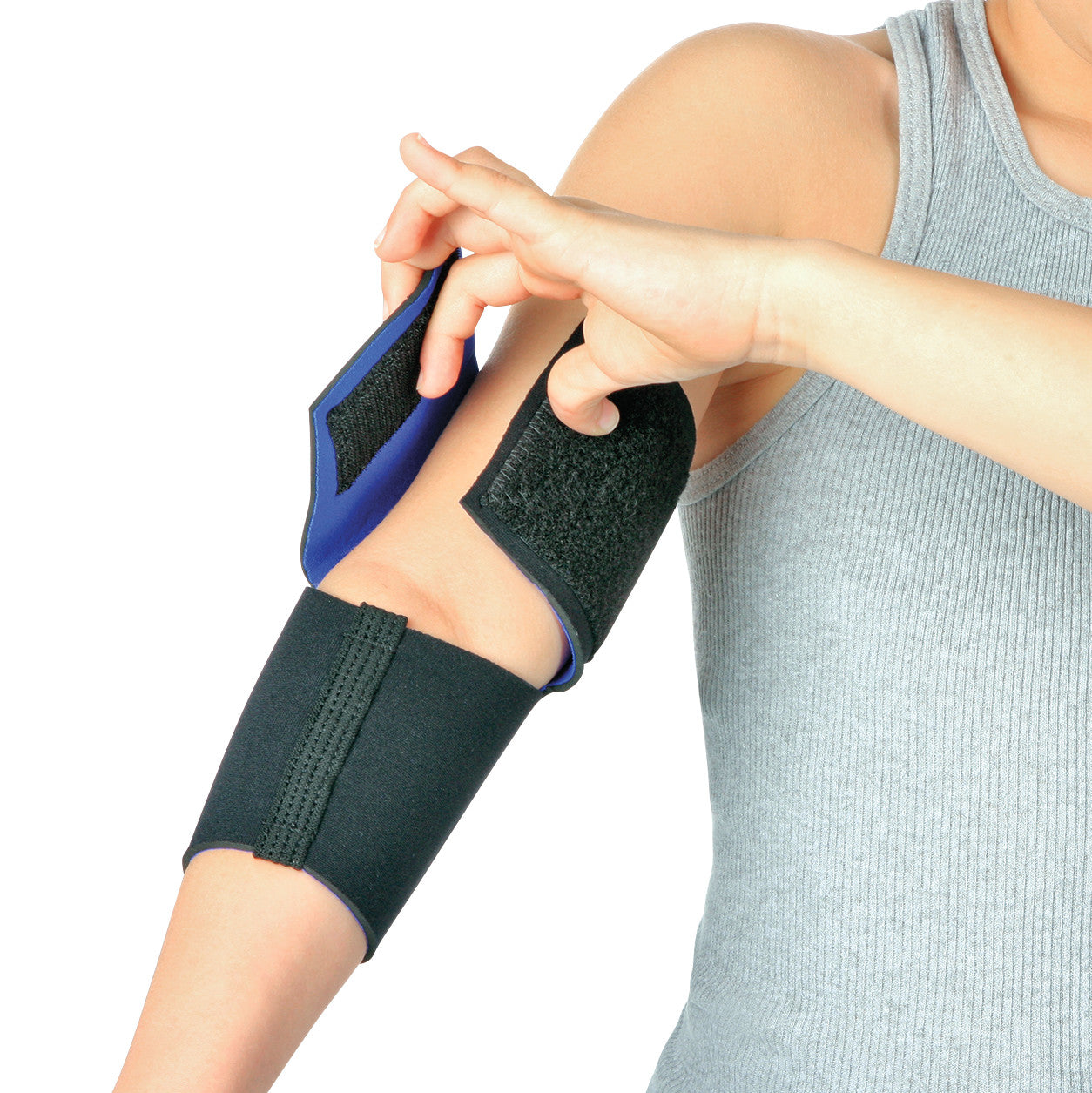 Person adjusting an AliMed FREEDOM Pediatric Elbow Sleeve on their arm. The black sleeve has a strap for secure fitting.