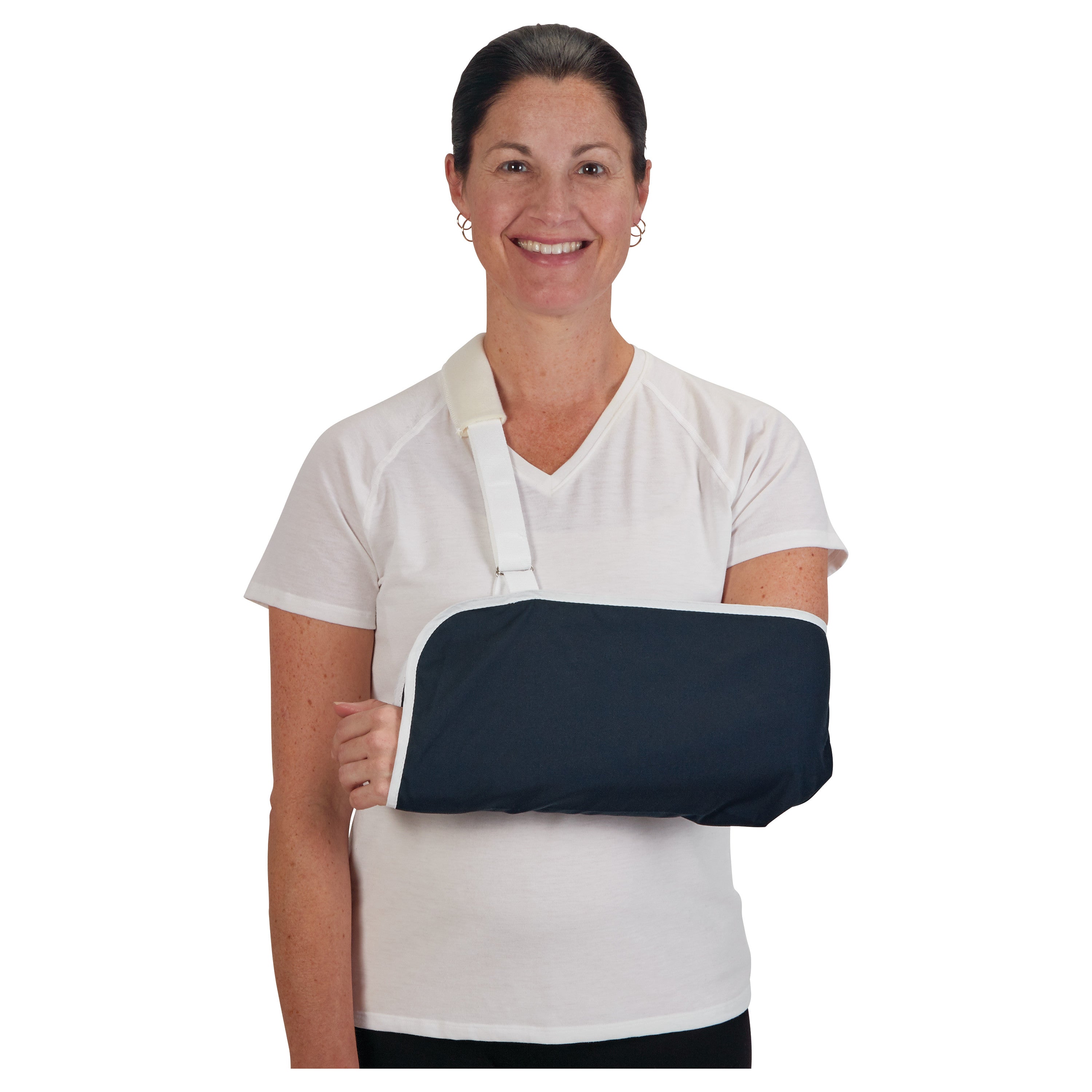 A woman wearing an AliMed Deluxe Envelope Style Arm Sling, featuring a navy fabric and white strap, over a white t-shirt.