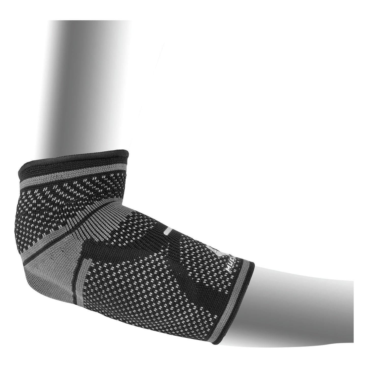 A black and gray Mueller Omniforce Elbow Support on a mannequin arm, showing its textured, breathable fabric and snug fit.