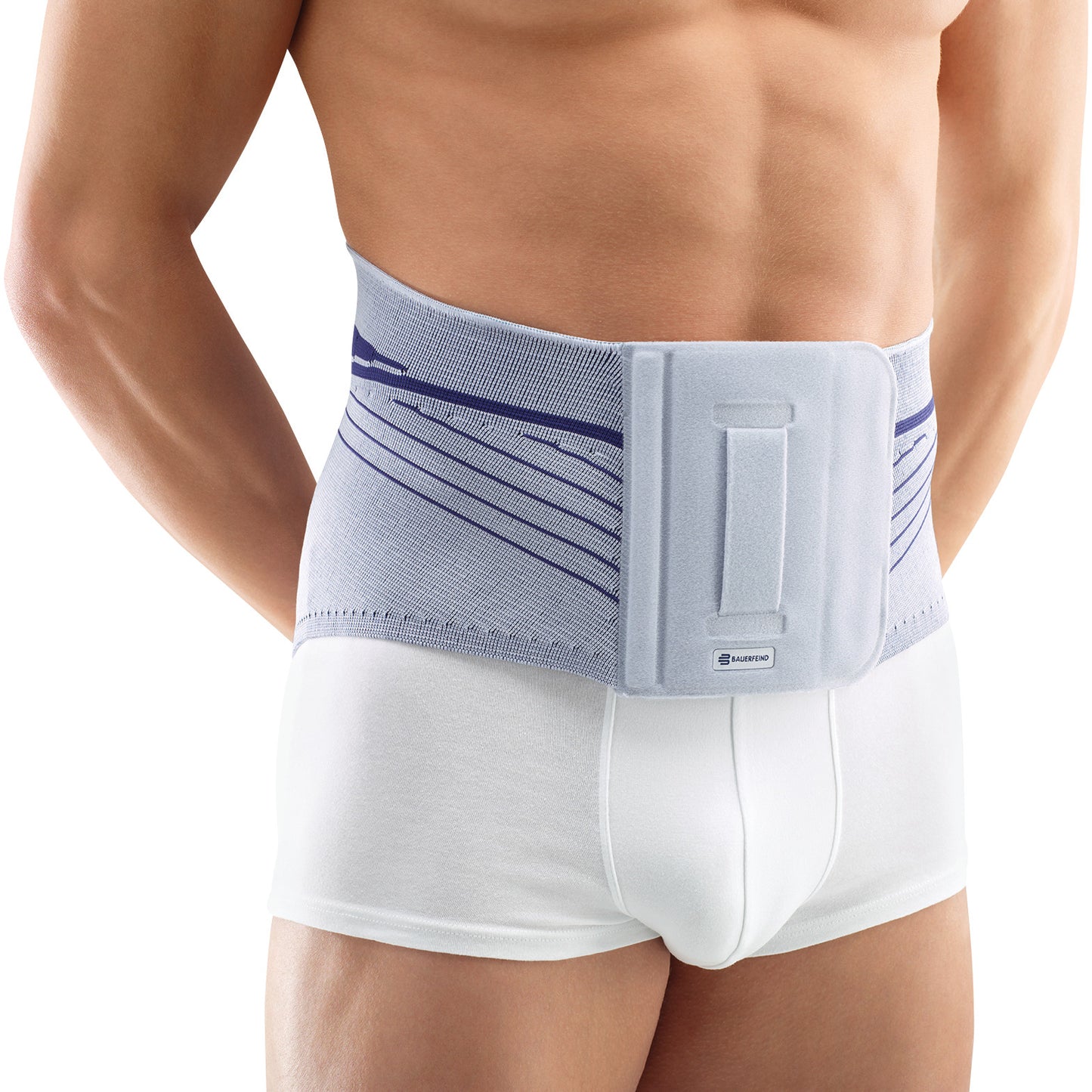 A person wears the Bauerfeind LumboLoc Back Support, a gray lumbar brace, around their waist for support, over white underwear.