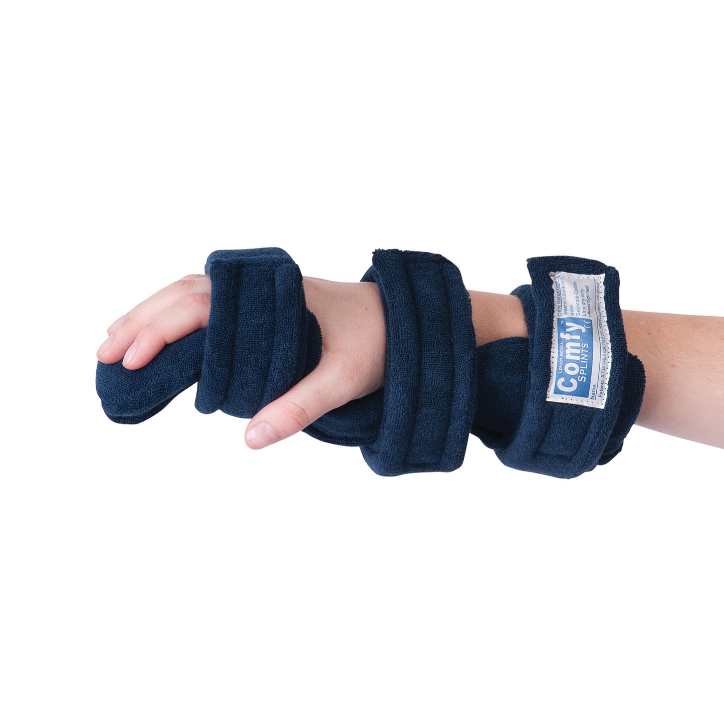 A hand is shown wearing a Comfy Splints Pediatric Hand/Wrist Orthosis, featuring a soft blue wrap with adjustable straps.