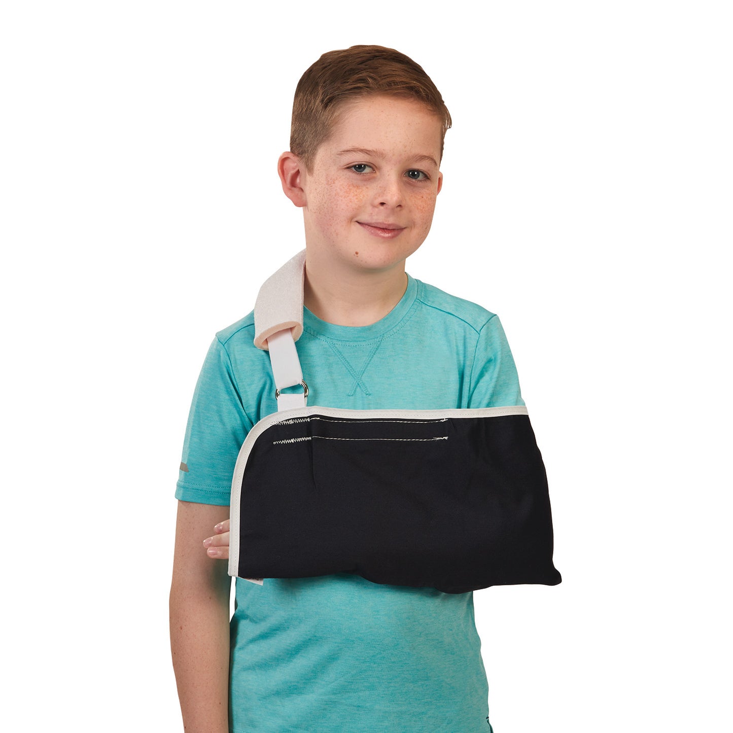 A young boy wears a Fits-All Sling, featuring a black arm support and white shoulder strap, over a turquoise shirt.