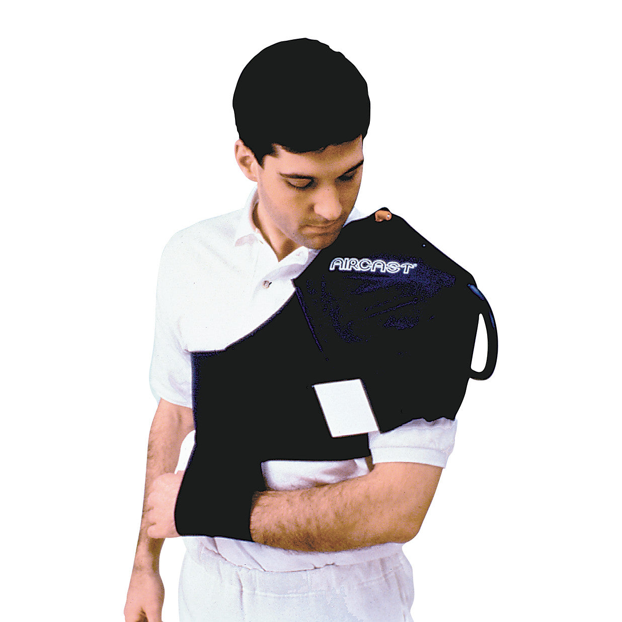 A person wears the Aircast Cryo/Cuff Shoulder Cuff, a black shoulder wrap designed for cold therapy, over a white shirt.
