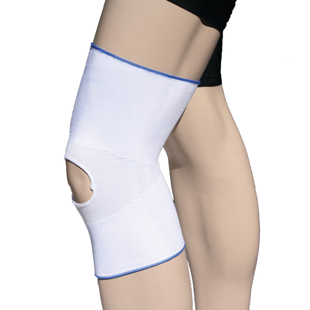 A person wears an AliMed Open Patella Brace, which is a white knee support with a hole for the kneecap.