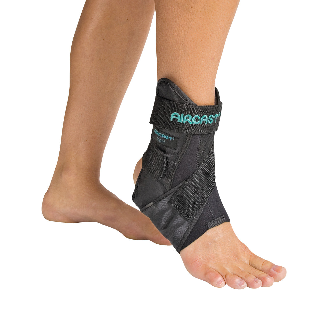 A person wearing an Aircast Airsport Ankle Brace. The brace is black with adjustable straps for support and stability.