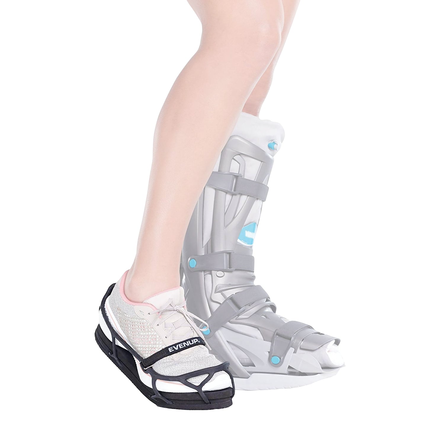 A person wears an EVENup Orthotic Shoe Lift on one foot and a gray medical boot on the other, designed to equalize leg length.