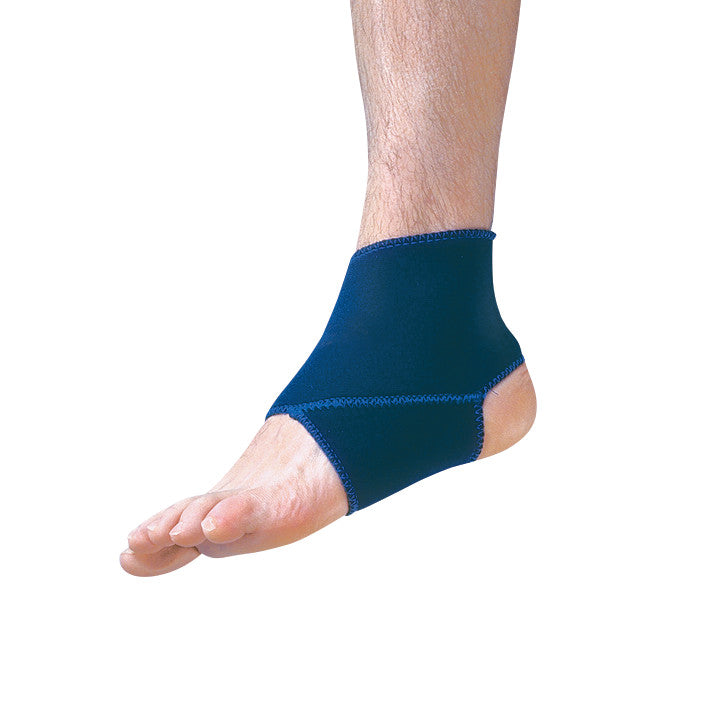 A person's right foot wearing an AliMed Neoprene Short Ankle Support, shown in navy blue with visible stitching.