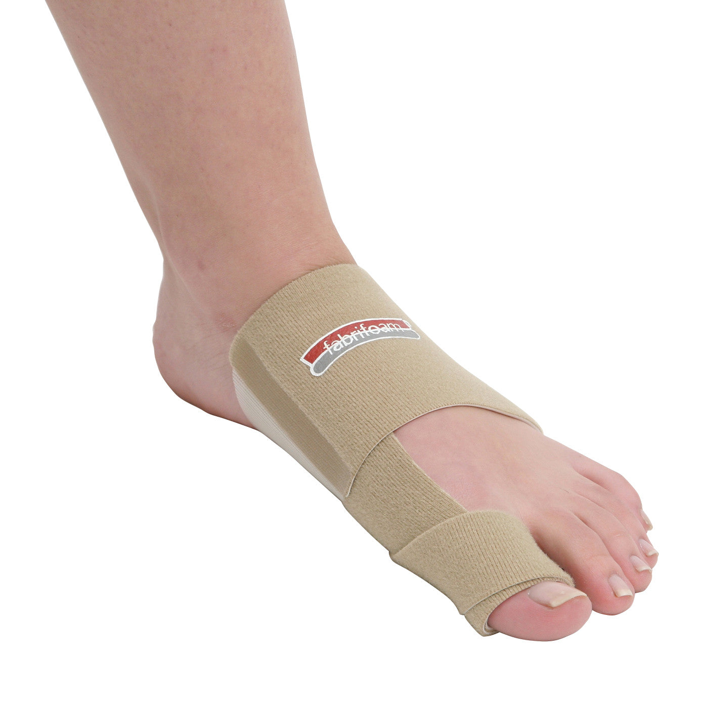 A foot wearing a beige Bunion Sling with a strap around the big toe and midfoot, featuring a "fabrifoam" logo.