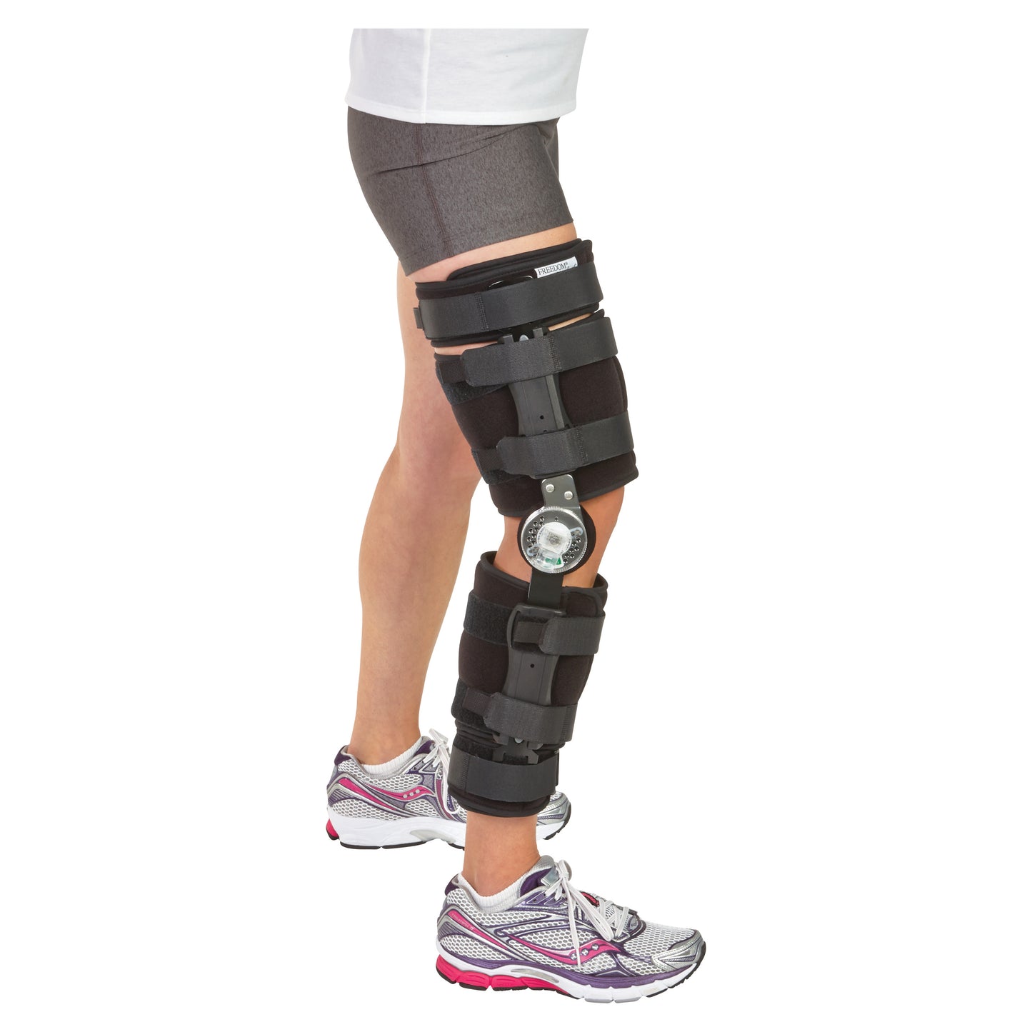 Person wearing the AliMed FREEDOM Comfort Post-Op Knee Brace with ROM Pin Hinge. It features adjustable straps and a metal hinge.
